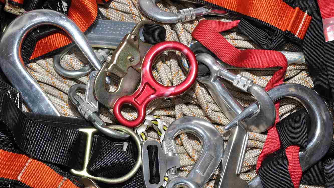 Fall protection gear, including carabiners, webbing, and ropes