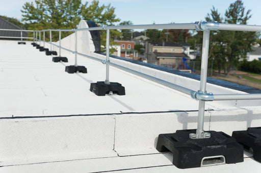 Rooftop with metal railing system for height safety