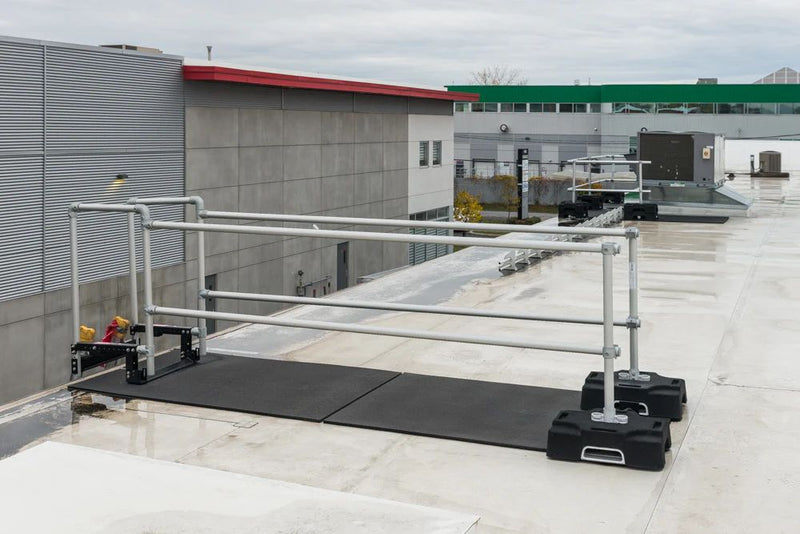 A ladder stabilizer is installed on the rooftop for safety at heights.