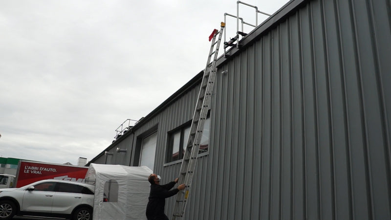 Ladder stabilizer installed for fall protection safety