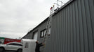 Ladder stabilizer installed for fall protection safety