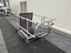 A metal railing with a safety for fall protection on a rooftop