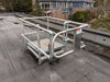 A metal railing with a safety for fall protection on a rooftop