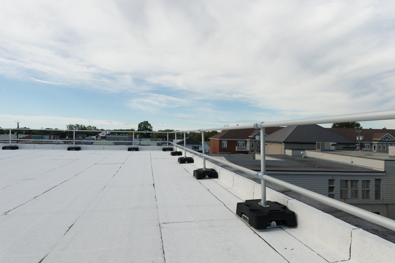 Rooftop view with a railing for fall protection safety